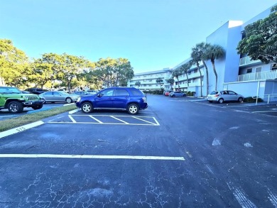 Beautiful 1BR/1.5BA condo with ceramic tile flooring in gated