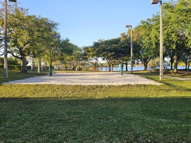 Beautiful 1BR/1.5BA condo with ceramic tile flooring in gated