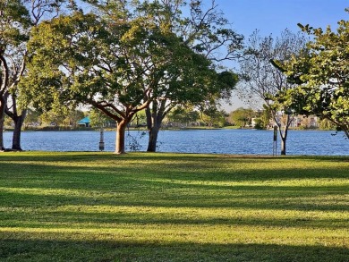 Beautiful 1BR/1.5BA condo with ceramic tile flooring in gated