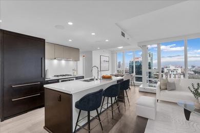Experience elevated living in this rare 2 Bd/2 Ba & Den & Flex