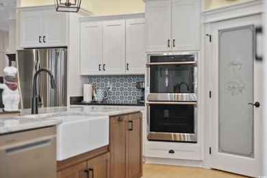 Experience the ease of single-level living in one of the rare