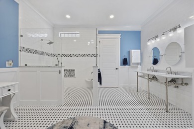 Experience the ease of single-level living in one of the rare