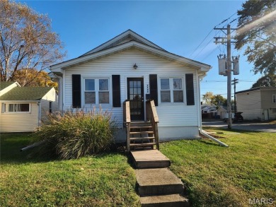 Nicely updated home on corner lot with detached garage. Home has