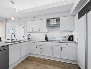 Set above the sparkling waters of Sarasota Bay, this beautifully