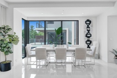 Newer construction-corner 2-story condo w/floor-to-ceiling glass