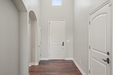 Enjoy tranquil golf course living and sweeping views from this