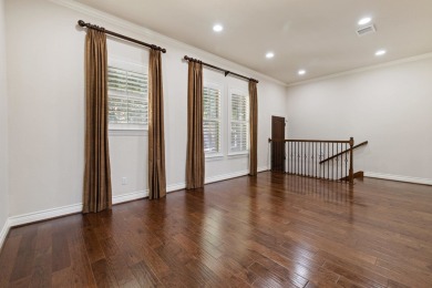 This immaculate 4-story townhome, ideally located on a quiet