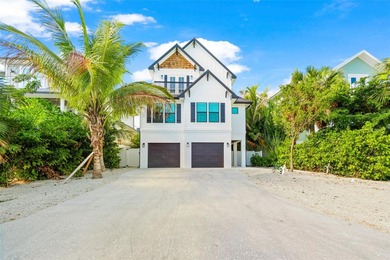 This exceptional newer-built coastal retreat on Lido Key
