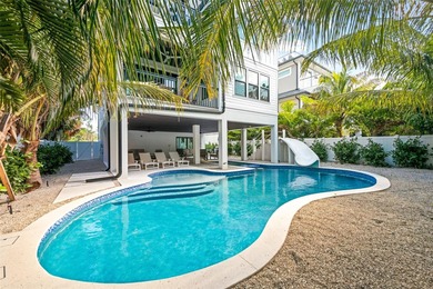 This exceptional newer-built coastal retreat on Lido Key