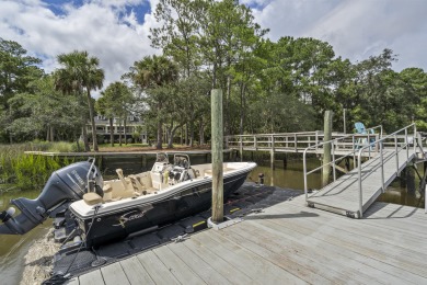 This Lowcountry Estate sits on a park-like private lot with