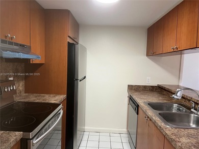 CENTRALLY LOCATED ALL TILE 2 BED 2 BATH CONDO WITH BEAUTIFUL