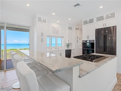 Welcome to a stunning coastal-modern beachfront estate on