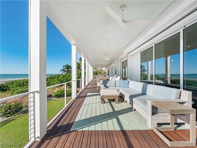 Welcome to a stunning coastal-modern beachfront estate on