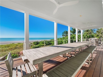 Welcome to a stunning coastal-modern beachfront estate on