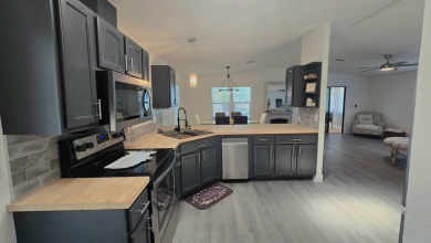 TAKE A LOOK! Step into modern comfort and convenience in this