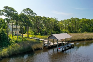 Welcome to your waterfront sanctuary at 95 Bluebell Cir, Santa