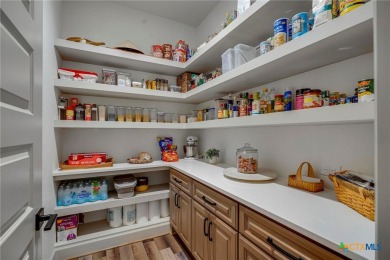 Situated on nearly 5 private acres in the prestigious Mystic