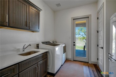 Situated on nearly 5 private acres in the prestigious Mystic