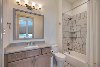 Situated on nearly 5 private acres in the prestigious Mystic