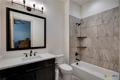 Situated on nearly 5 private acres in the prestigious Mystic