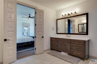 Situated on nearly 5 private acres in the prestigious Mystic