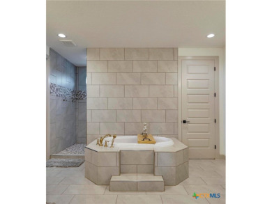 Situated on nearly 5 private acres in the prestigious Mystic