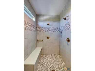 Situated on nearly 5 private acres in the prestigious Mystic