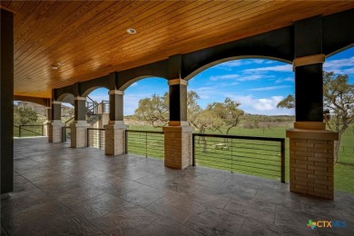Situated on nearly 5 private acres in the prestigious Mystic