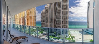 Experience breathtaking oceanfront living in this elegant