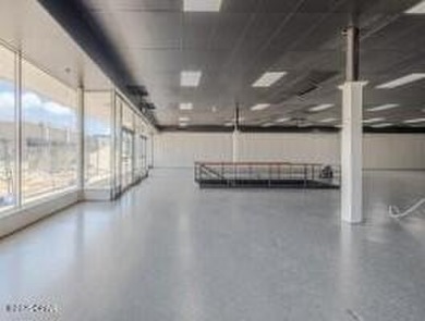 This solidly constructed, three-level commercial building offers