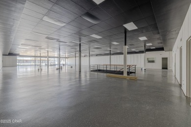 This solidly constructed, three-level commercial building offers