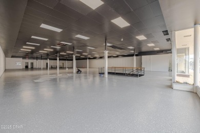 This solidly constructed, three-level commercial building offers