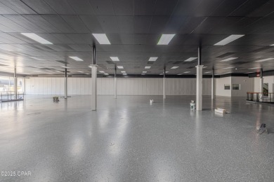 This solidly constructed, three-level commercial building offers