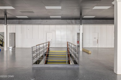 This solidly constructed, three-level commercial building offers