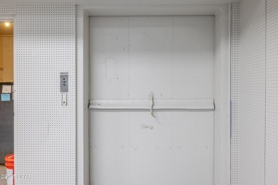 This solidly constructed, three-level commercial building offers