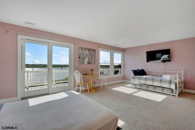 NOW IS YOUR CHANCE TO OWN A CUSTOM BUILT BAY FRONT HOME. THIS