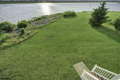 NOW IS YOUR CHANCE TO OWN A CUSTOM BUILT BAY FRONT HOME. THIS