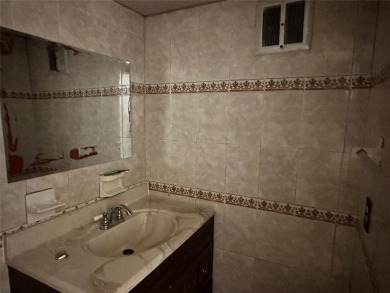 A Gorgeous 3 bedrooms and 2 baths with a den that is currently