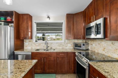 Waterfront living is within reach. This lovely home sits on a