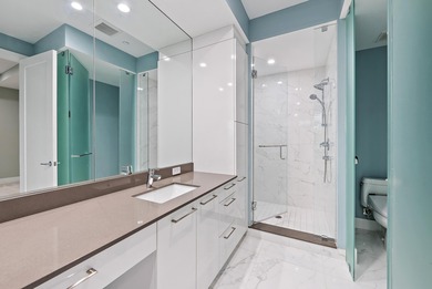 An elevated expression of coastal living, this three-story Water