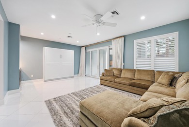 An elevated expression of coastal living, this three-story Water