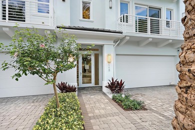 An elevated expression of coastal living, this three-story Water