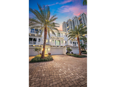An elevated expression of coastal living, this three-story Water