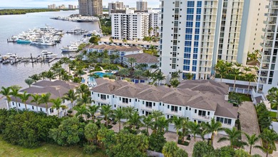 An elevated expression of coastal living, this three-story Water