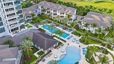 An elevated expression of coastal living, this three-story Water