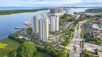 An elevated expression of coastal living, this three-story Water