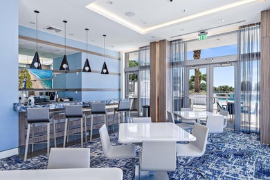 An elevated expression of coastal living, this three-story Water