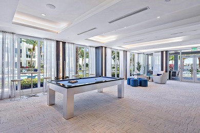 An elevated expression of coastal living, this three-story Water