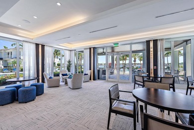 An elevated expression of coastal living, this three-story Water