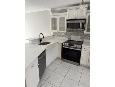 This spacious 2 bedroom condo, is securely located in a gated